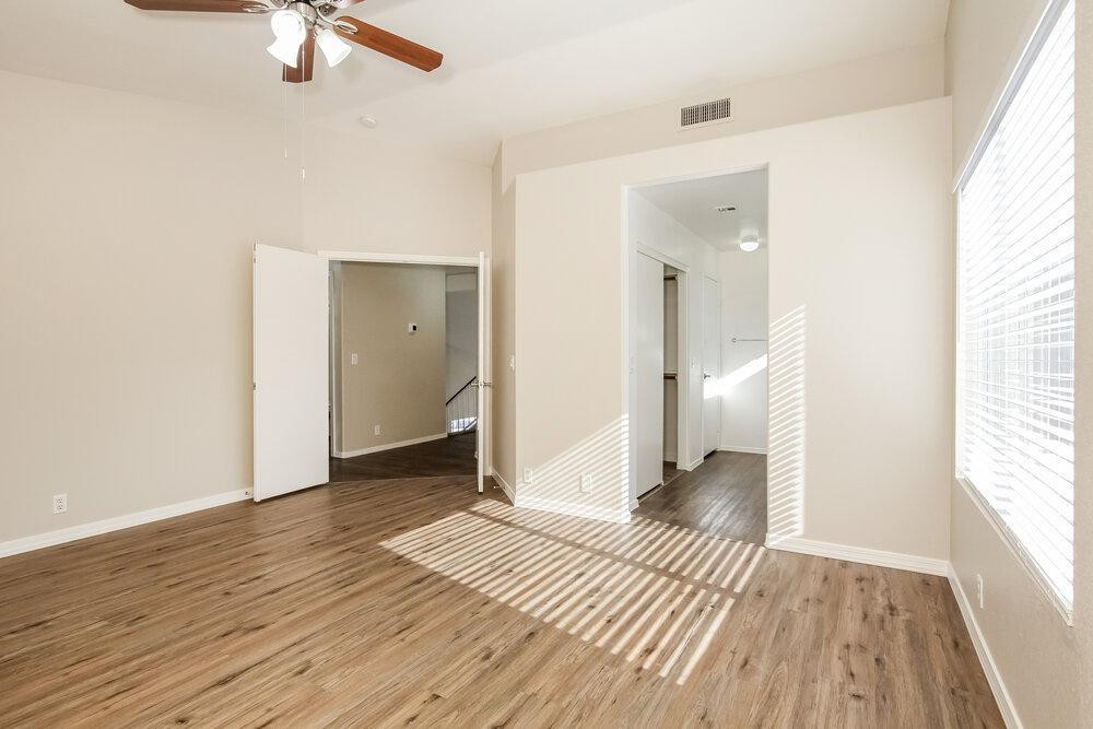 9243 West St John Road Peoria, AZ 85382 - Photo 8 of 17 a view of a room with wooden floor and a bathroom