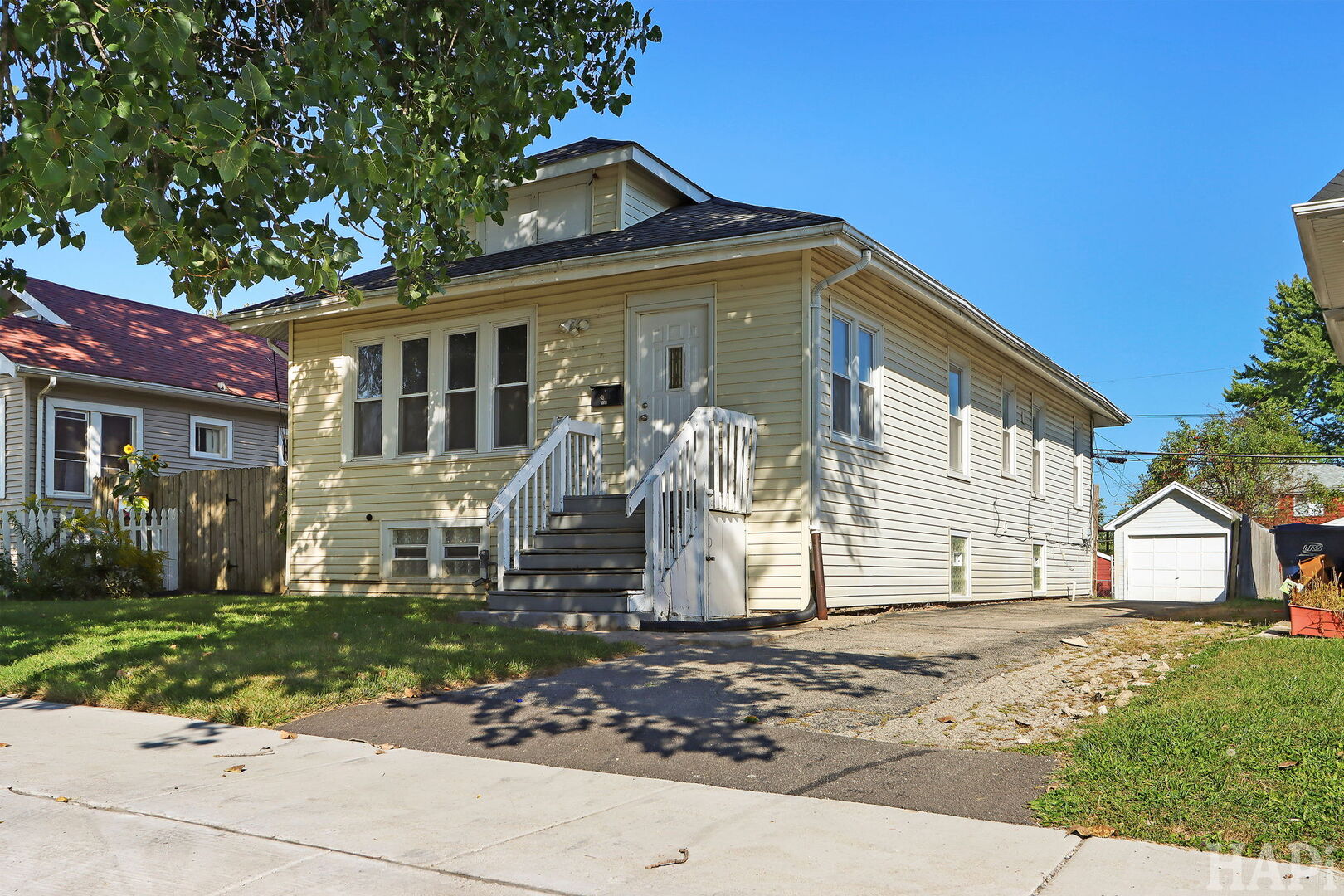 619 North Butrick Street Waukegan, IL 60085 - Photo 1 of 20 a front view of a house with a yard