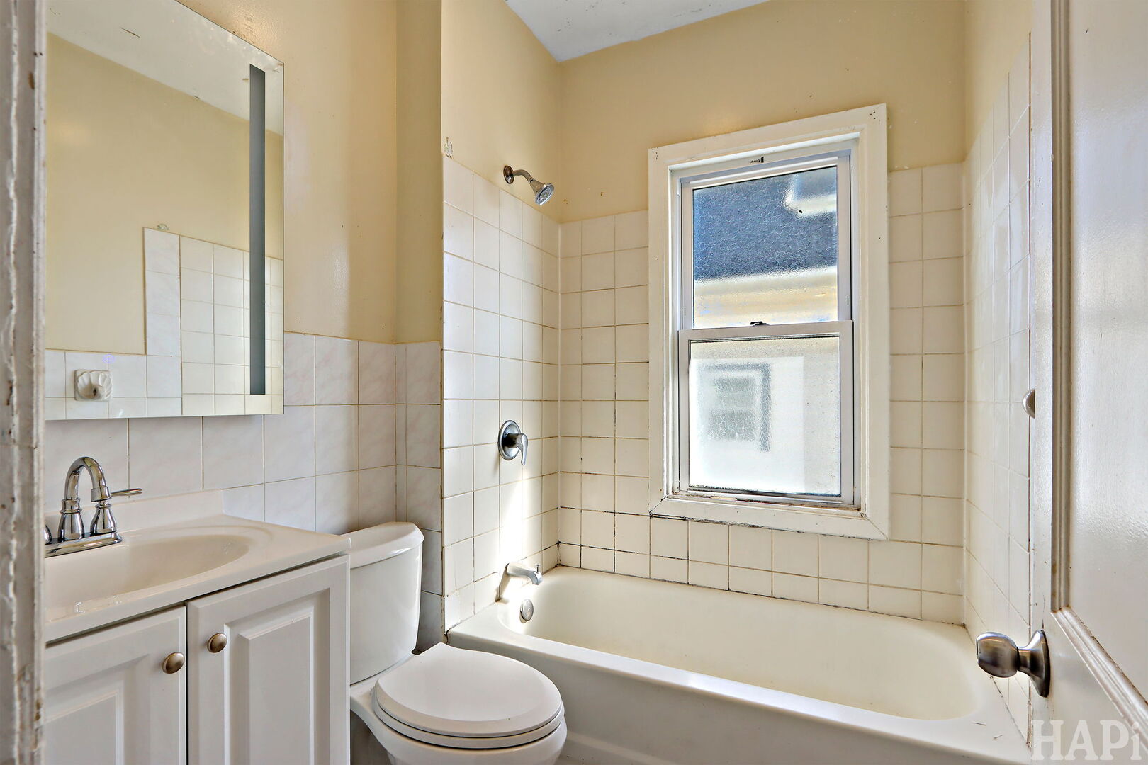 619 North Butrick Street Waukegan, IL 60085 - Photo 8 of 20 a bathroom with a sink a toilet and shower