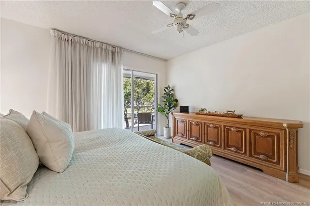 a view of a bedroom with furniture and a window
