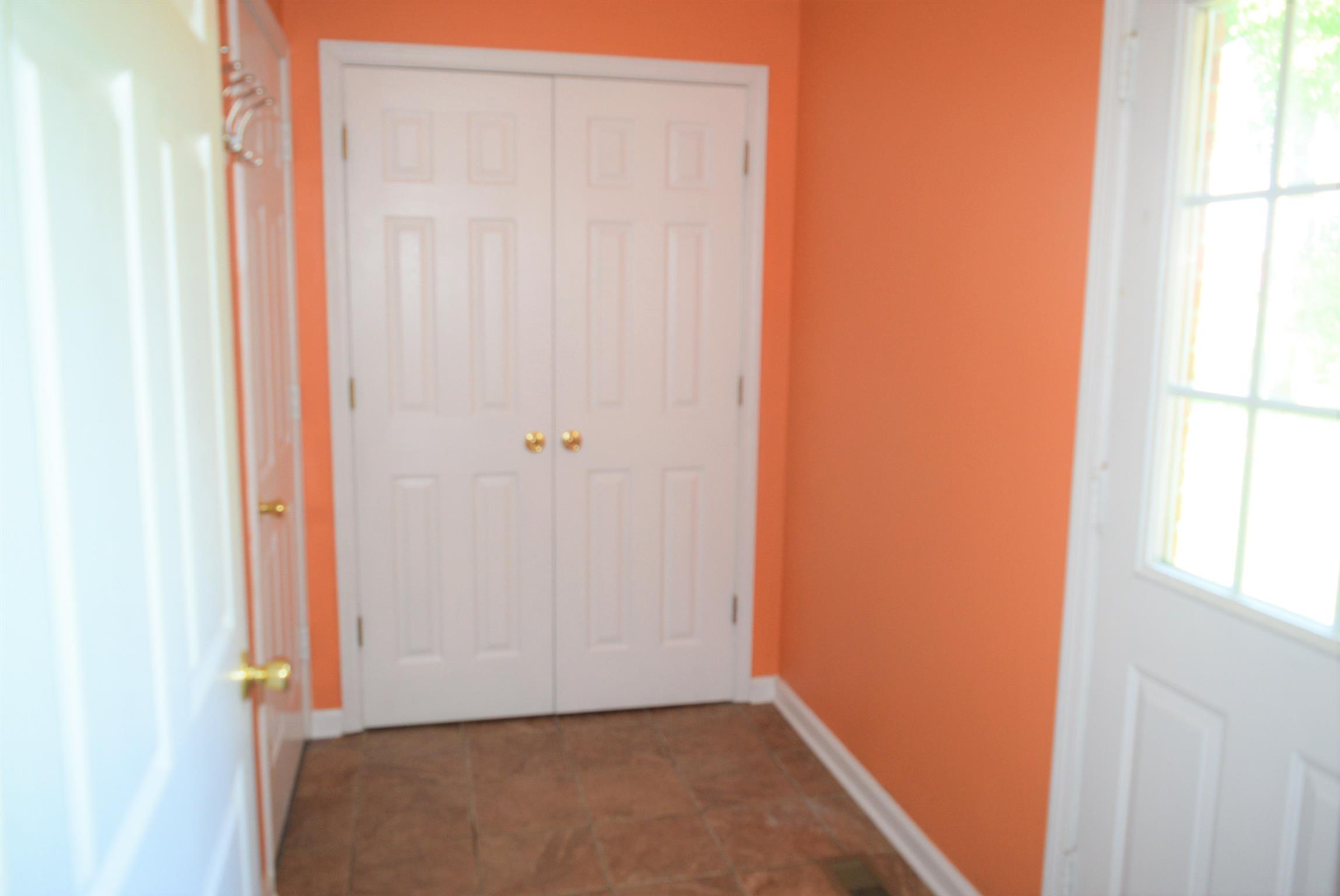 4893 Albright Road Clarksville, TN 37043 - Photo 16 of 20 Hallway from the kitchen to the laundry room, patio, and the garage.