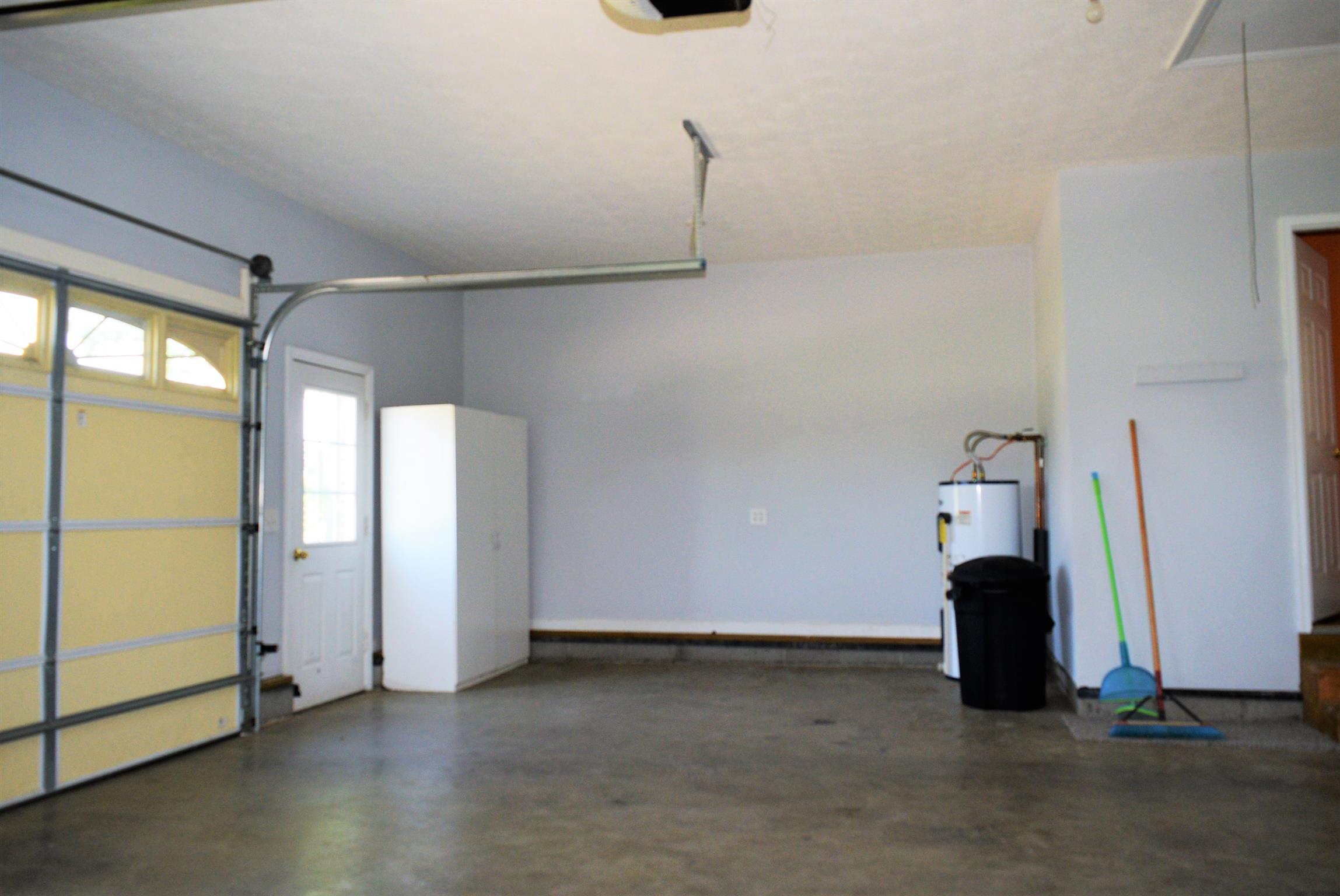 4893 Albright Road Clarksville, TN 37043 - Photo 17 of 20 The attached garage has plenty of space for storage and has a pull-down attic.