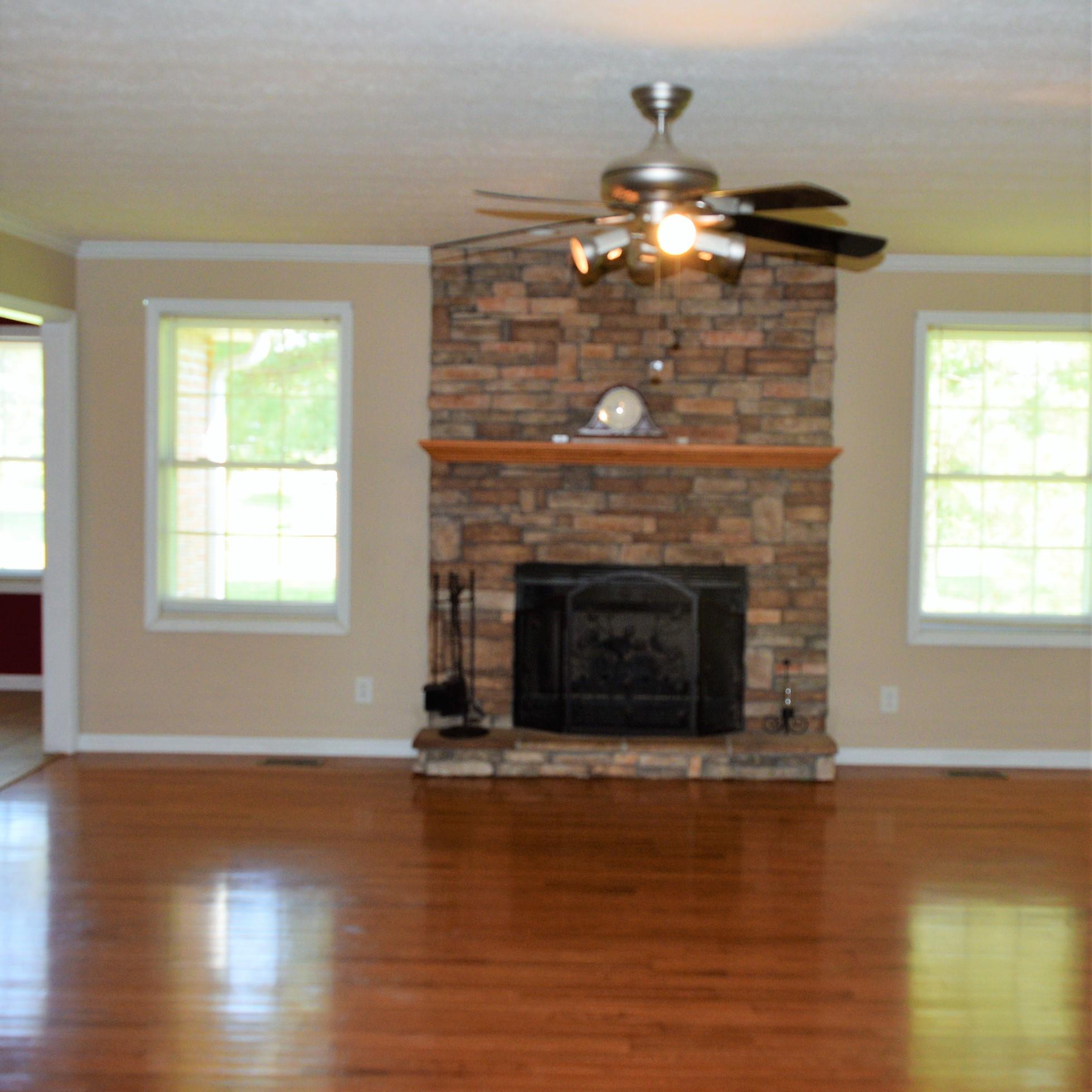 4893 Albright Road Clarksville, TN 37043 - Photo 8 of 20 Wonderful stone fireplace in the living room!