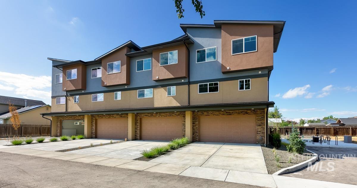 2281-2299 North Shaelyn Lane Boise, ID 83713 - Photo 1 of 29 View of front of home with concrete driveway, stucco siding, and a garage