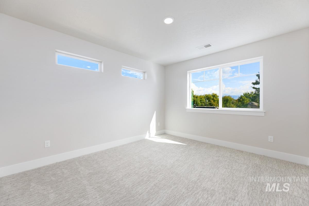 2281-2299 North Shaelyn Lane Boise, ID 83713 - Photo 19 of 29 Carpeted empty room featuring baseboards and recessed lighting