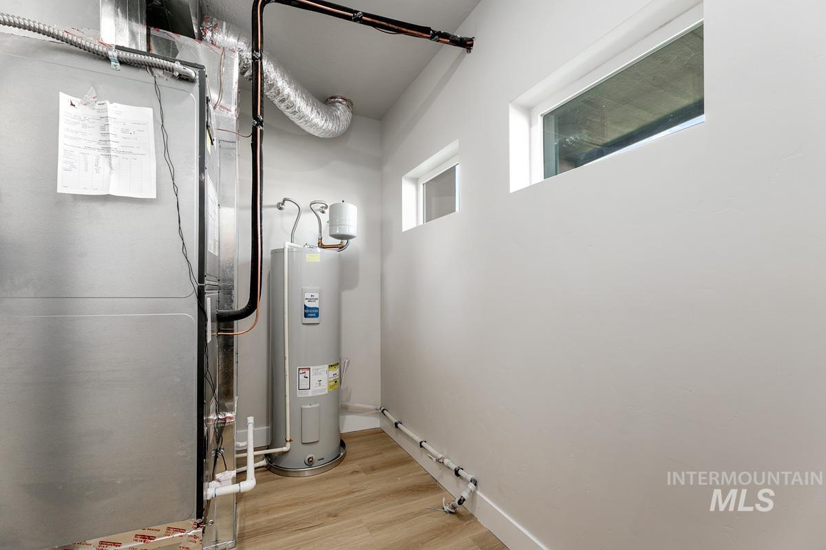 2281-2299 North Shaelyn Lane Boise, ID 83713 - Photo 24 of 29 Utility room featuring heating unit and water heater