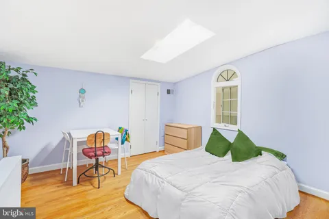 a bedroom with a bed and a table in it