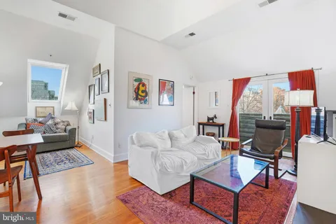 a living room with furniture and a couch