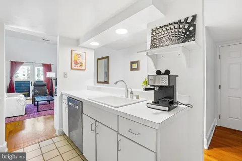 a kitchen with a sink cabinets and appliances