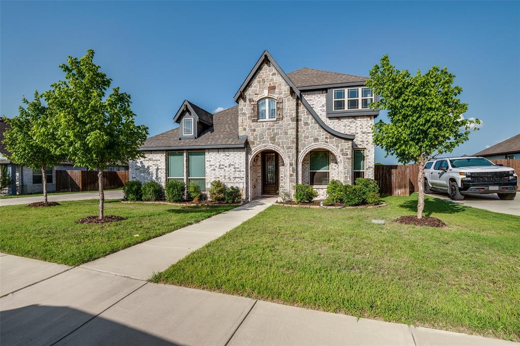 4609 Massey Meadows Way Midlothian, TX 76065 - Photo 1 of 25 a front view of a house with a garden