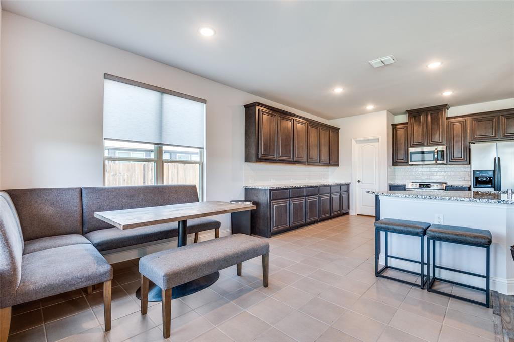 4609 Massey Meadows Way Midlothian, TX 76065 - Photo 11 of 25 a living room with furniture and a kitchen
