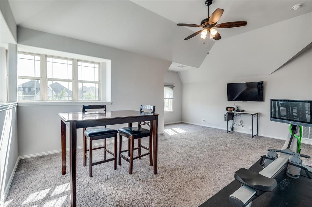 4609 Massey Meadows Way Midlothian, TX 76065 - Photo 14 of 25 a view of a livingroom with furniture and a flat screen tv