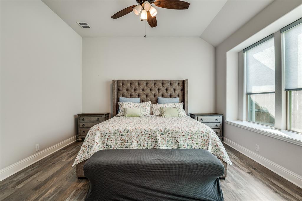 4609 Massey Meadows Way Midlothian, TX 76065 - Photo 16 of 25 a bedroom with a large bed and a window