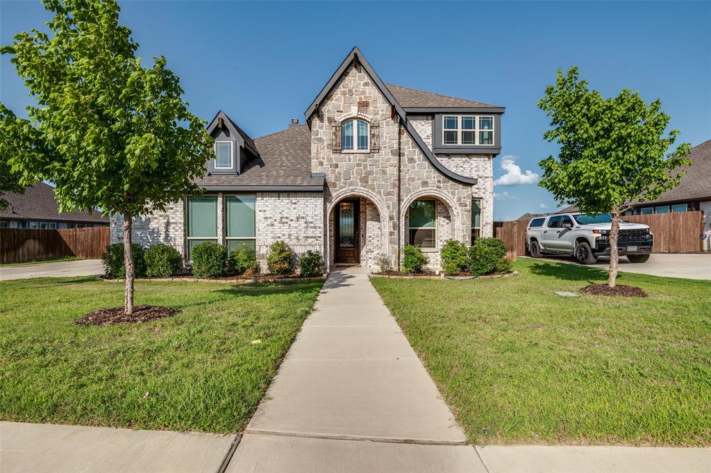 4609 Massey Meadows Way Midlothian, TX 76065 - Photo 2 of 25 a front view of a house with a yard