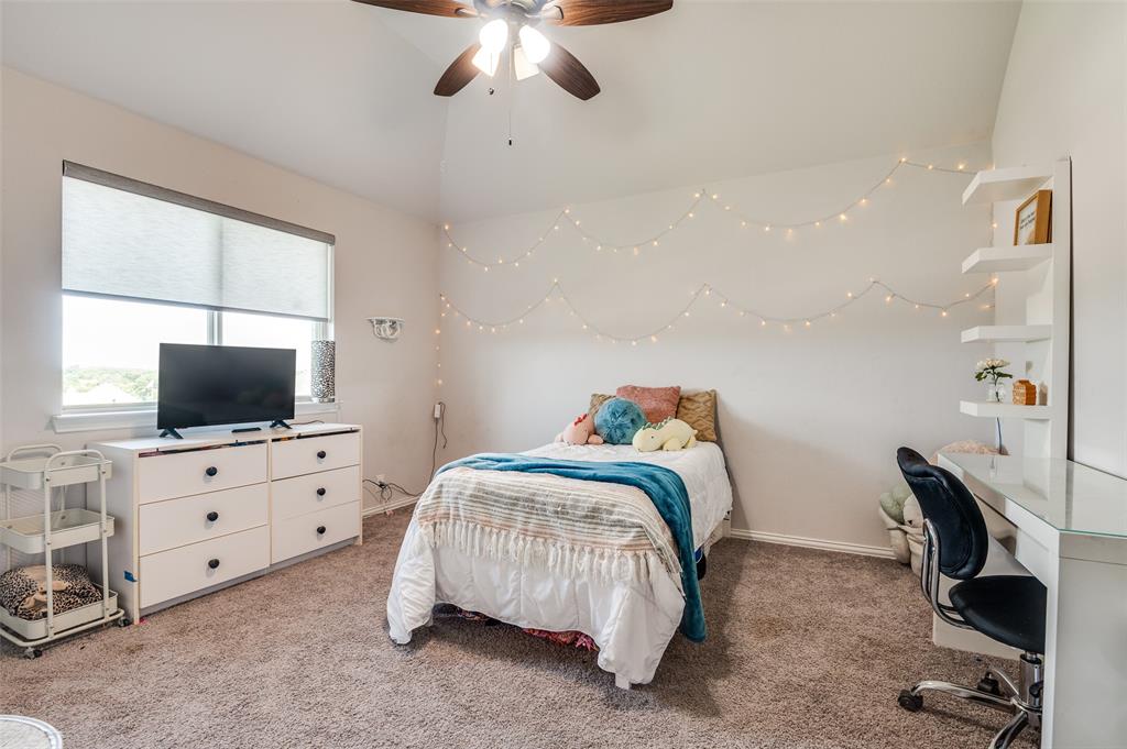 4609 Massey Meadows Way Midlothian, TX 76065 - Photo 22 of 25 a bedroom with a bed and flat screen tv
