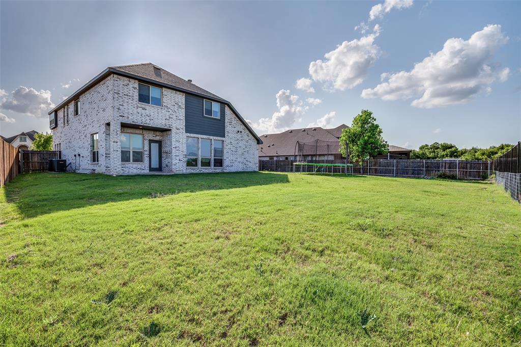 4609 Massey Meadows Way Midlothian, TX 76065 - Photo 24 of 25 a front view of a house with garden