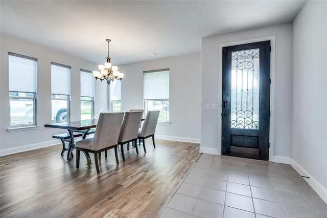 a view of a dining room with furniture and window