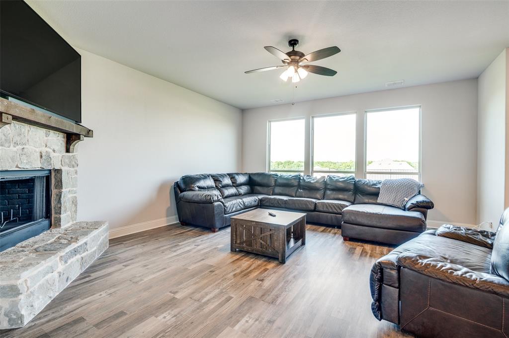 4609 Massey Meadows Way Midlothian, TX 76065 - Photo 7 of 25 a living room with furniture and a flat screen tv