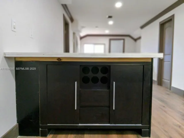 a kitchen with a sink and a refrigerator