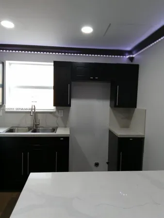 a bathroom with a sink and mirror