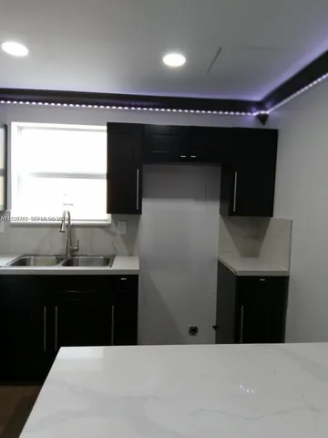 a bathroom with a sink and mirror