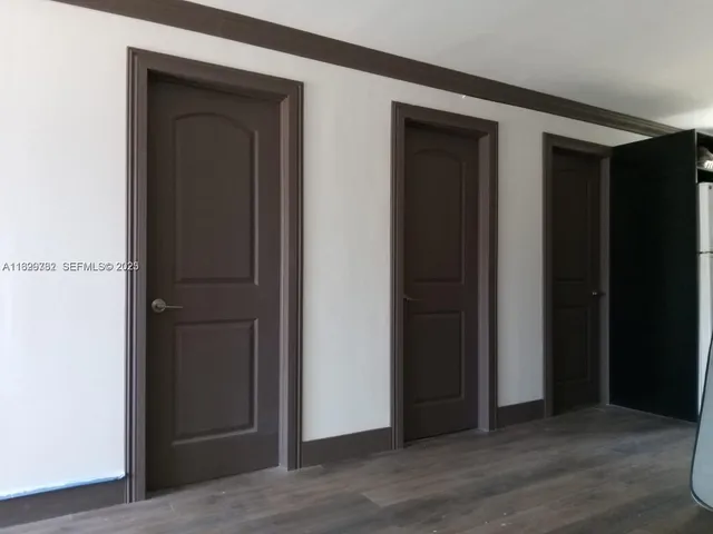 a house with trees in front of it