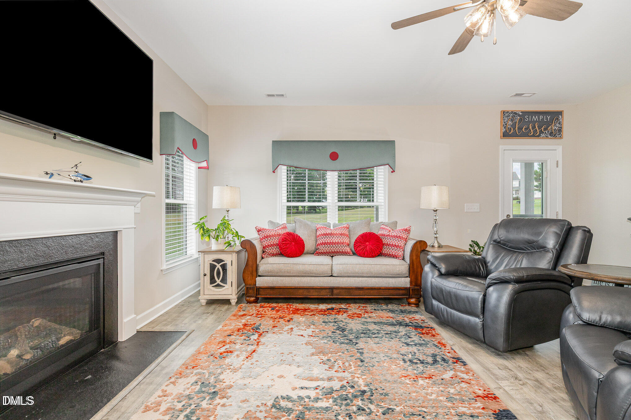 8662 Buckhorn Plantation Road Sims, NC 27880 - Photo 16 of 37 a living room with furniture and a fireplace