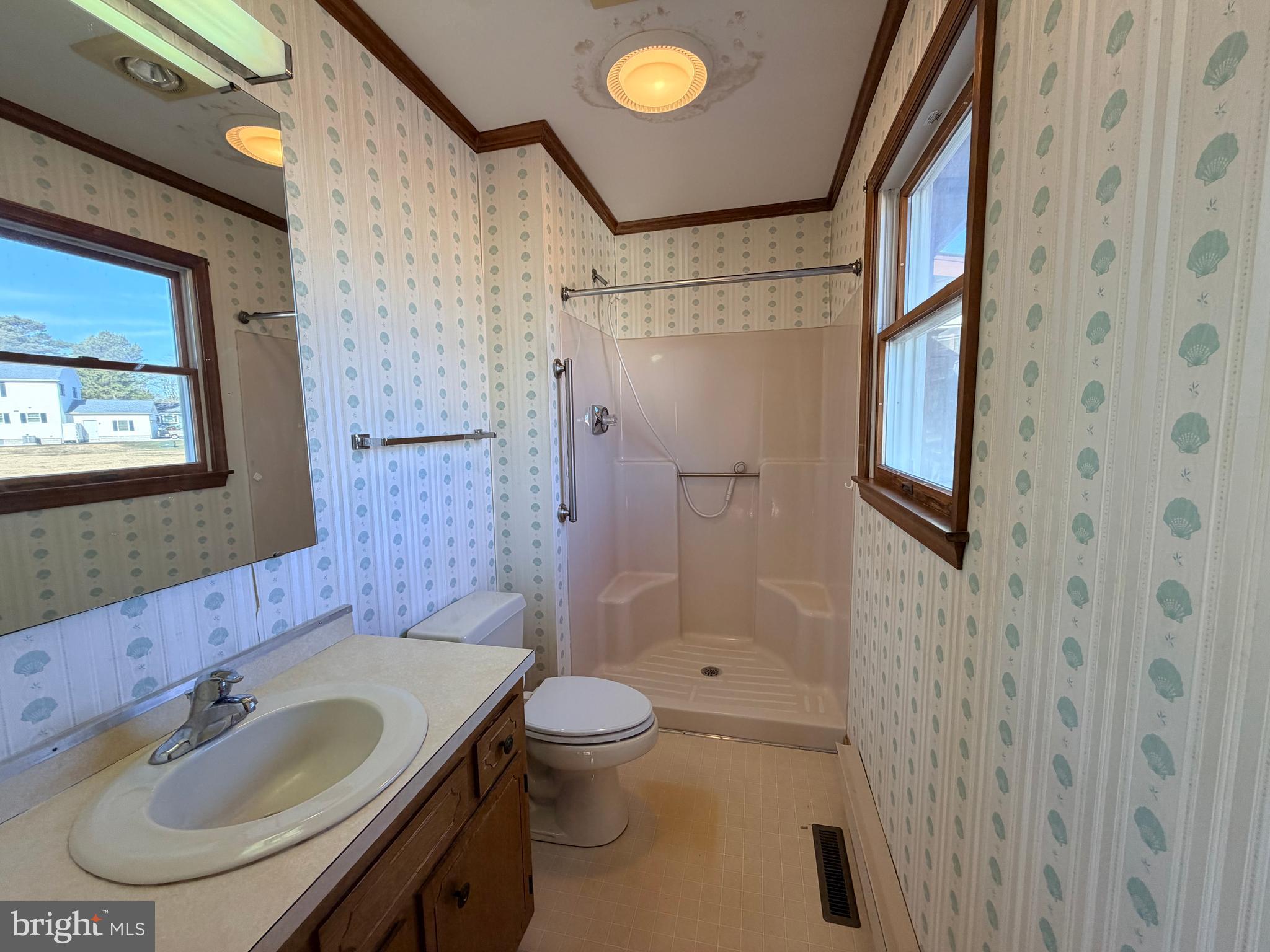31461 Hope Street Ocean View, DE 19970 - Photo 15 of 20 a bathroom with a sink toilet and shower