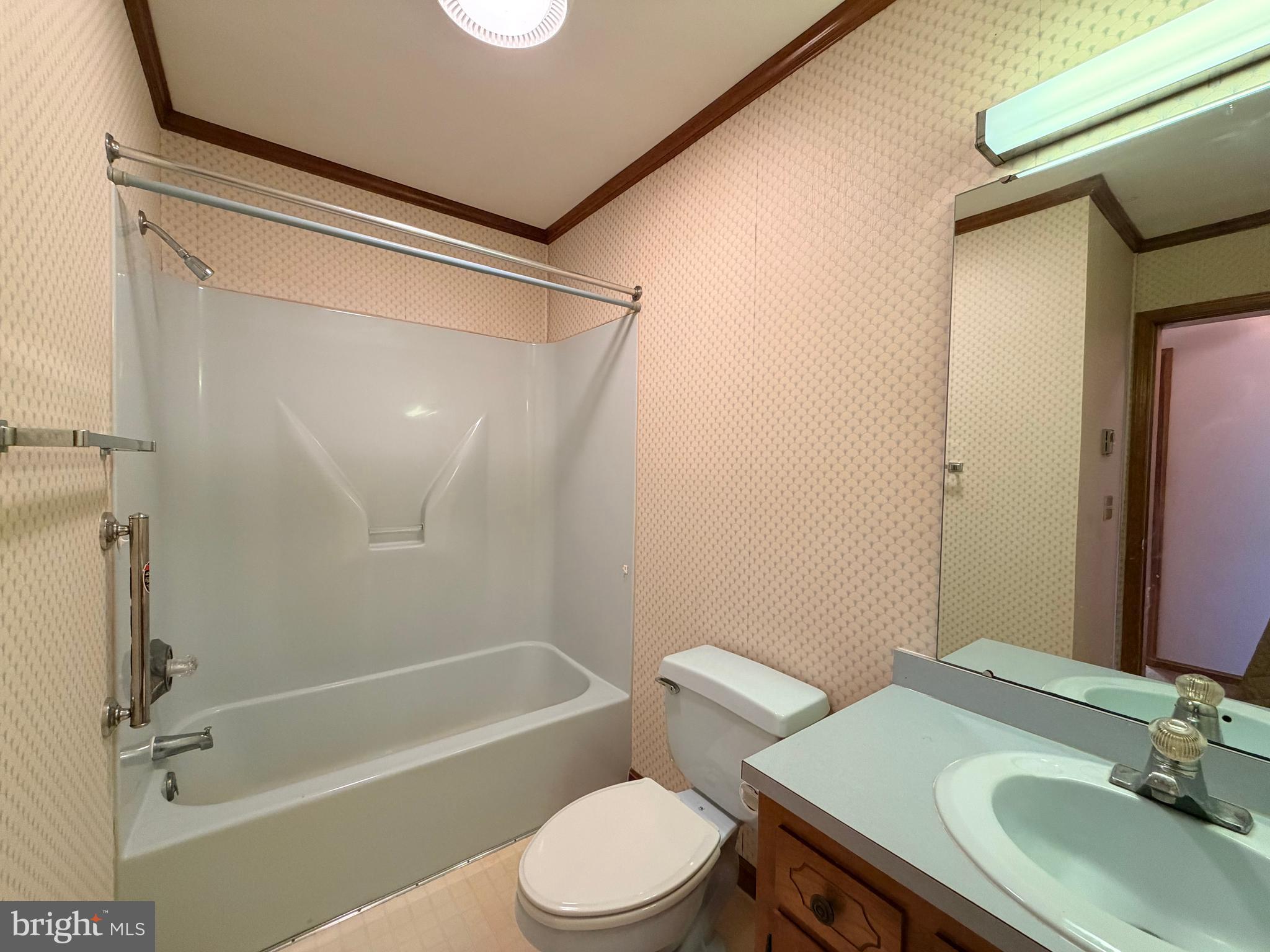 31461 Hope Street Ocean View, DE 19970 - Photo 18 of 20 a bathroom with a sink toilet and shower