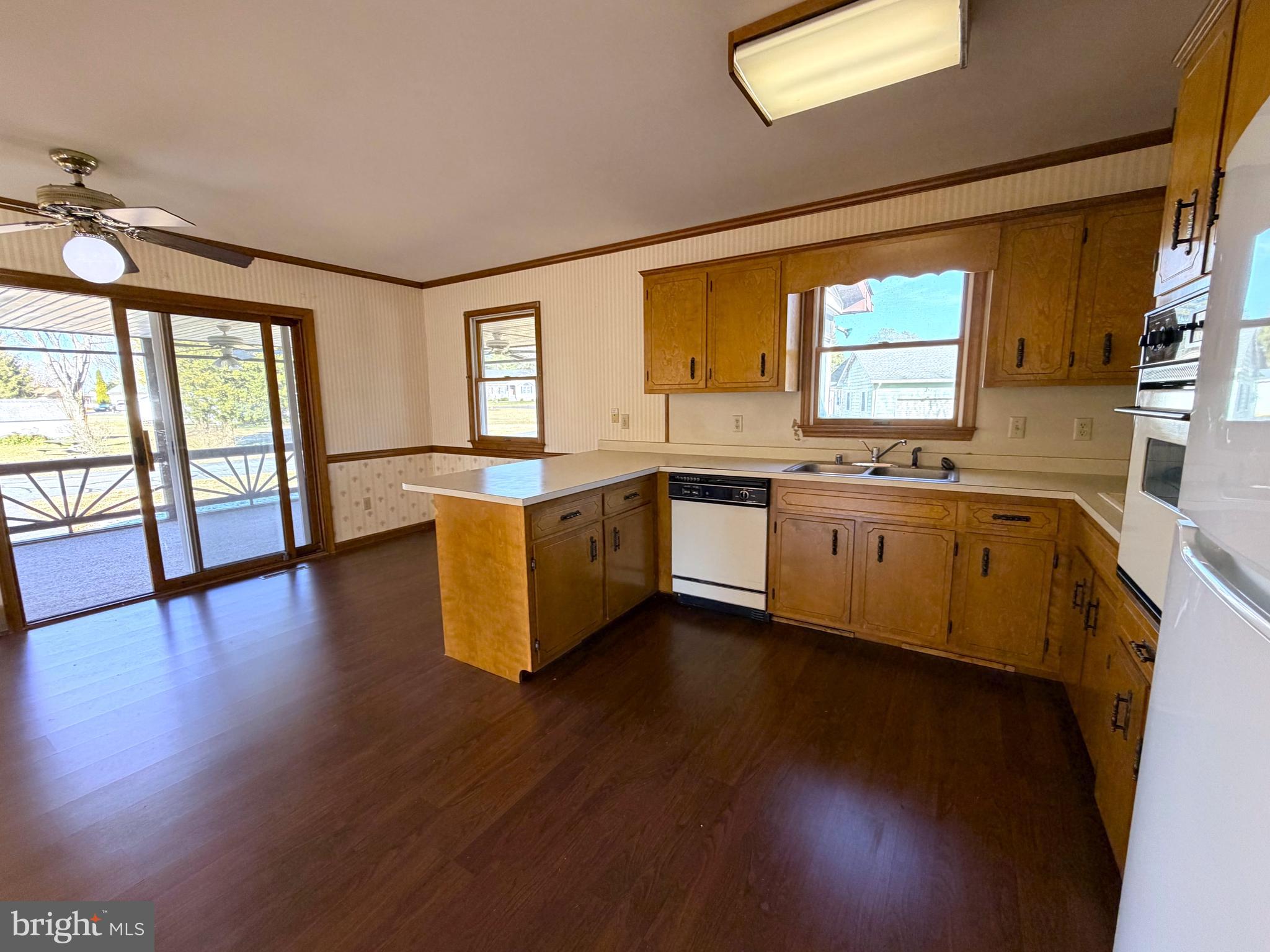 31461 Hope Street Ocean View, DE 19970 - Photo 10 of 20 a view of a kitchen with sink and wooden floor