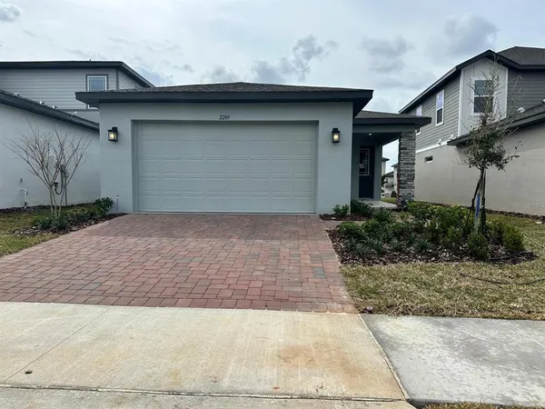 a front view of a house with garage