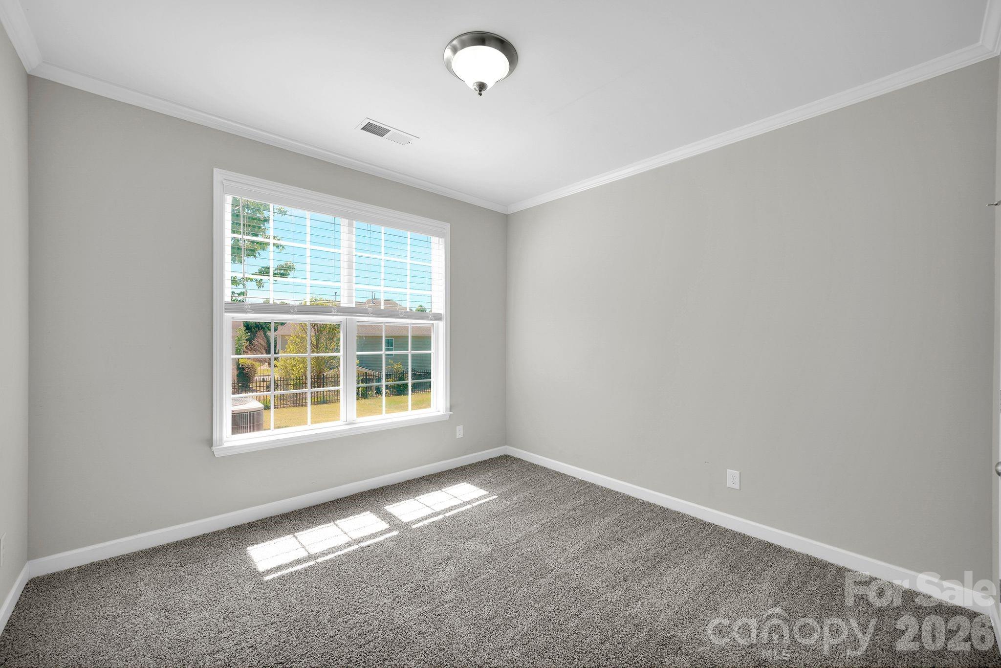 5072 Gladiola Way Tega Cay, SC 29708 - Photo 16 of 40 an empty room with a window