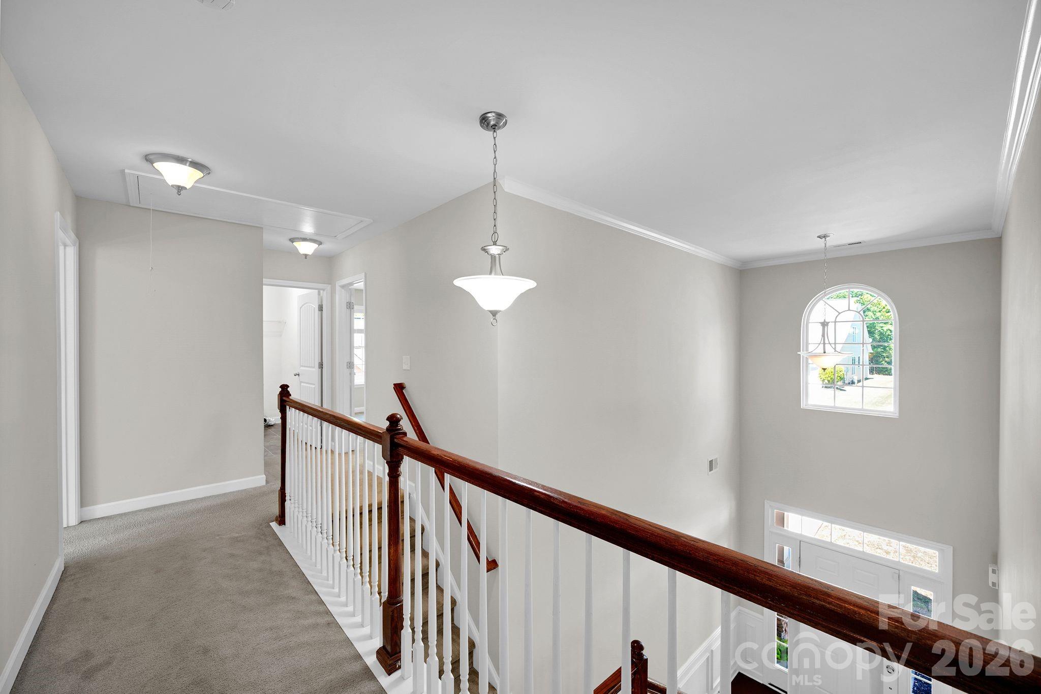 5072 Gladiola Way Tega Cay, SC 29708 - Photo 18 of 40 a view of a hallway with windows