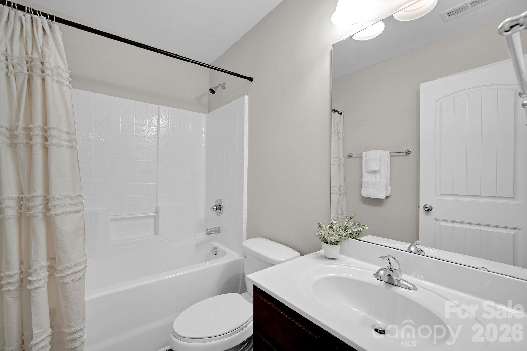 5072 Gladiola Way Tega Cay, SC 29708 - Photo 27 of 40 a bathroom with a sink toilet and a bathtub