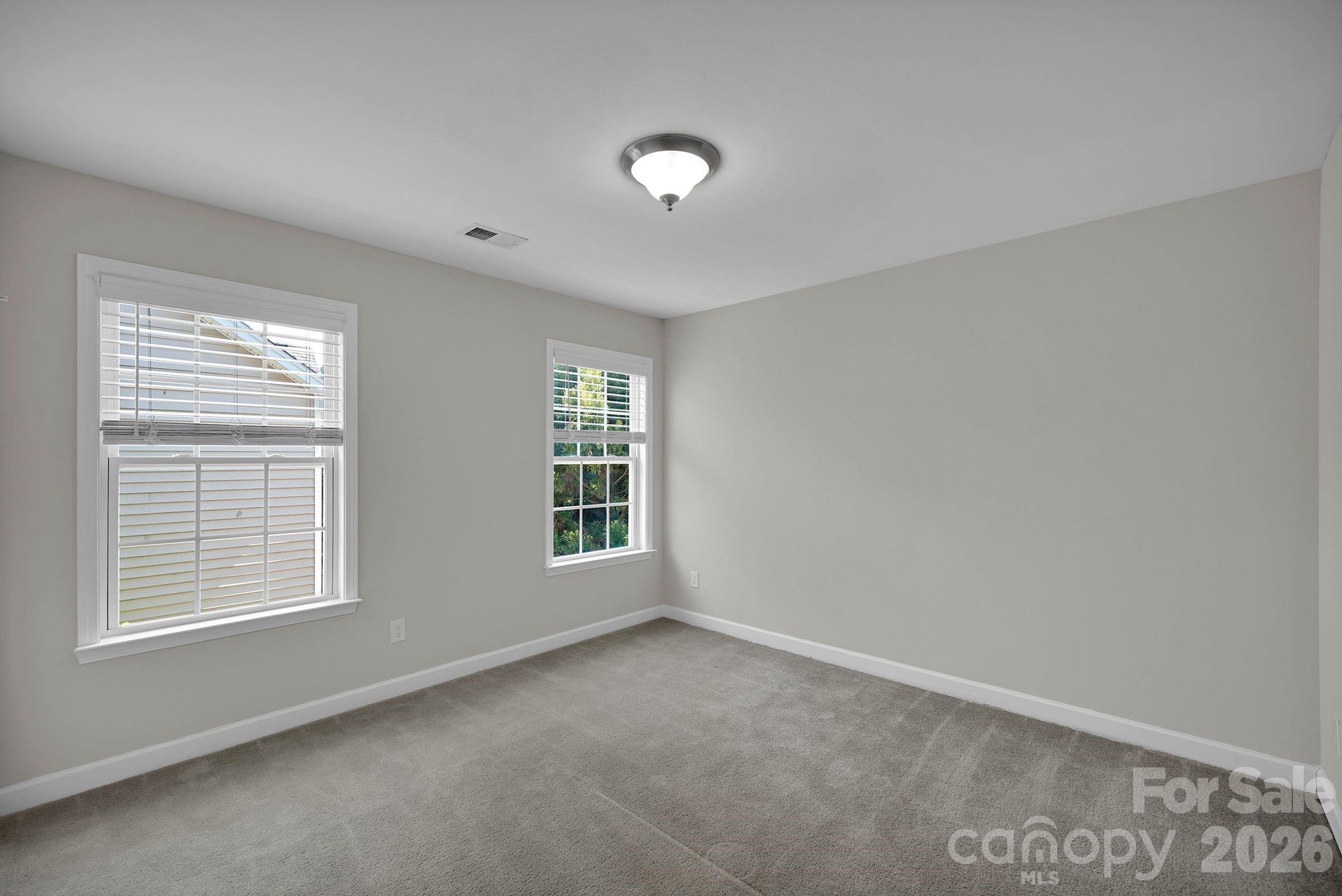 5072 Gladiola Way Tega Cay, SC 29708 - Photo 28 of 40 an empty room with a window