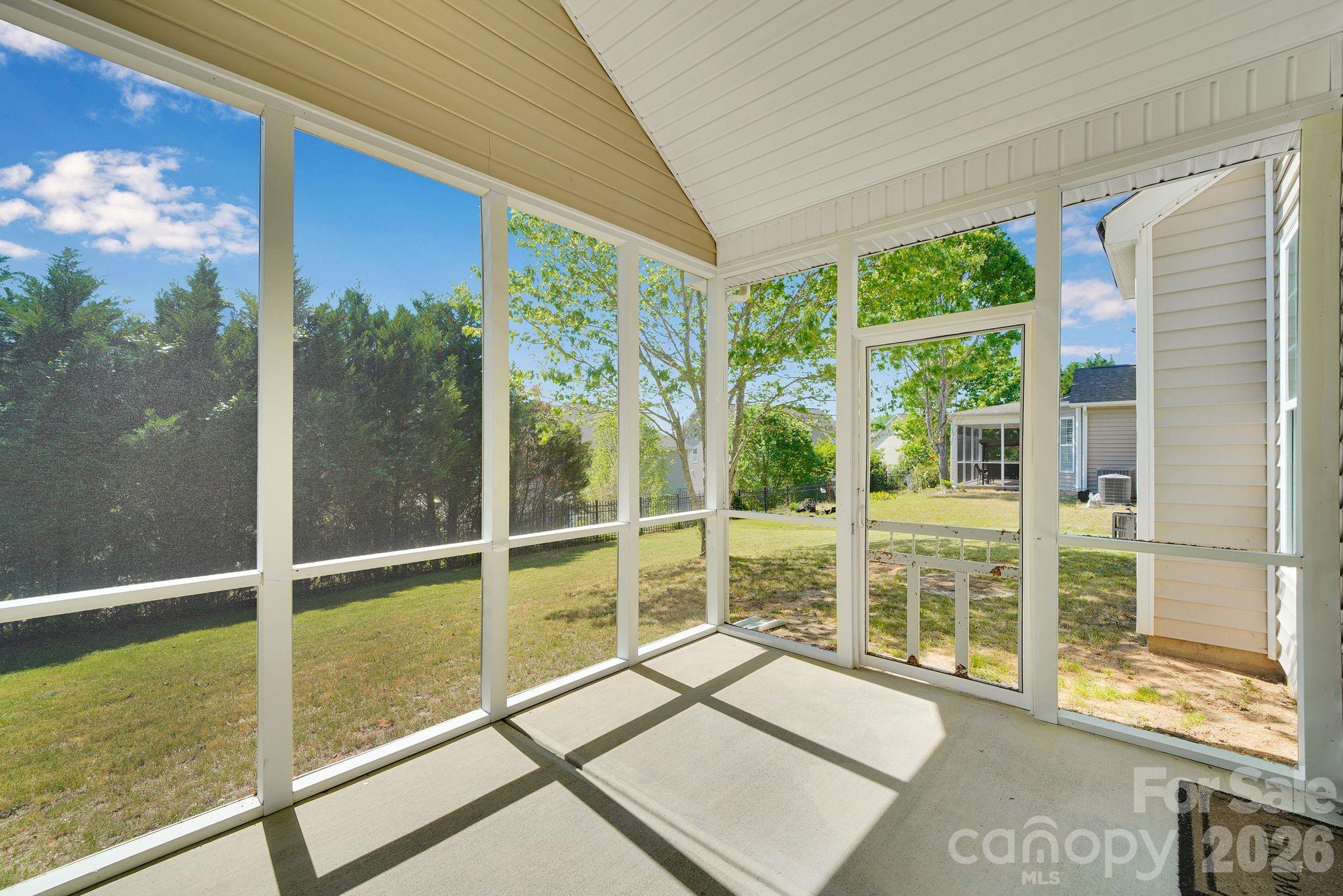 5072 Gladiola Way Tega Cay, SC 29708 - Photo 31 of 40 a view of a room with a large window and wooden floor