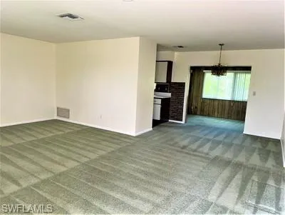 a view of a kitchen with furniture and a kitchen