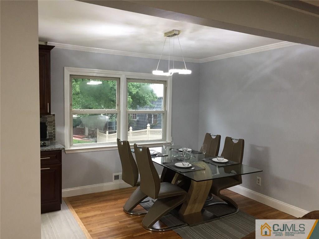 21 Meyer Road Edison, NJ 08817 - Photo 8 of 25 a view of a dining room with a table and chairs