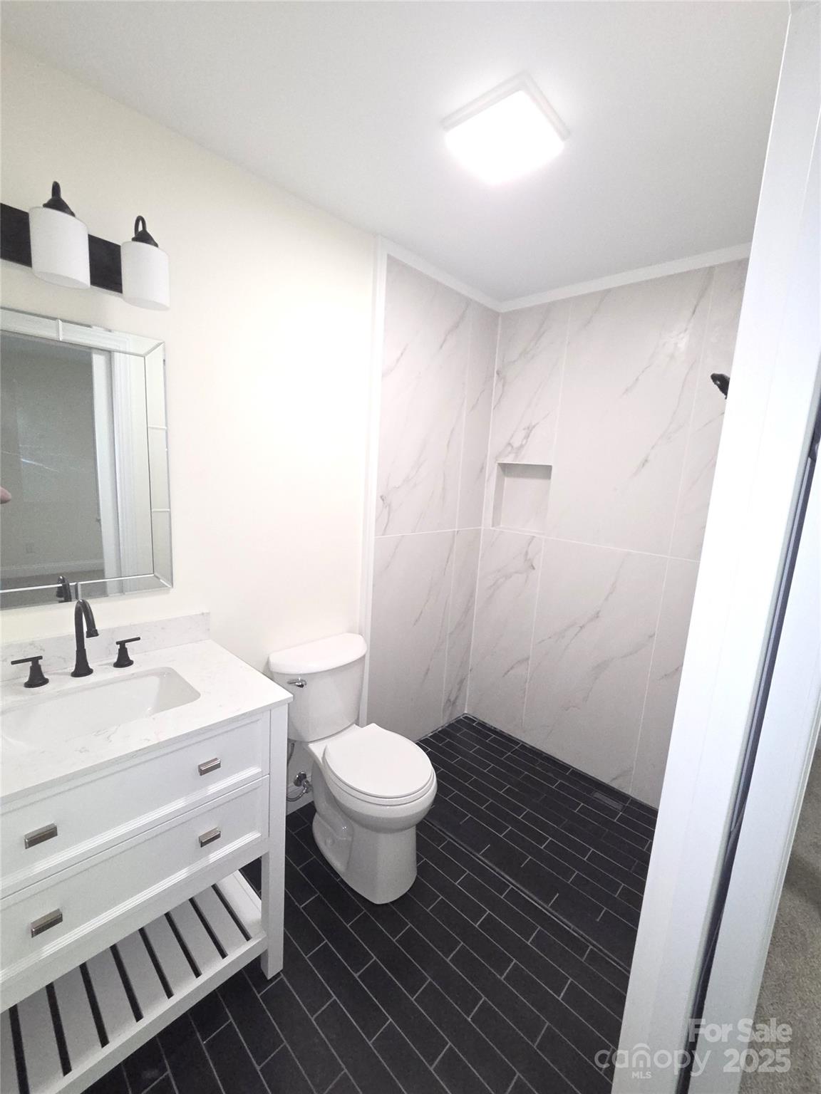 4750 J W Cline Road Kannapolis, NC 28083 - Photo 11 of 16 a bathroom with a double vanity sink toilet and a mirror