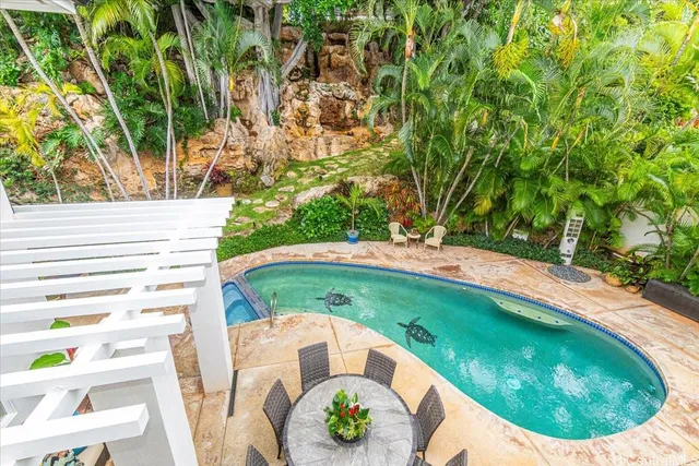 a view of swimming pool from a balcony