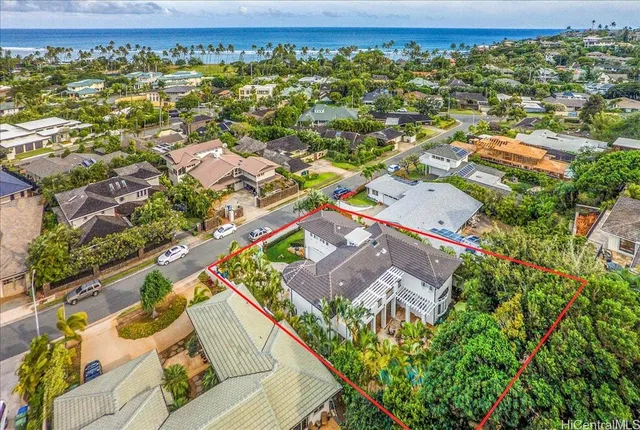 an aerial view of residential houses with outdoor space