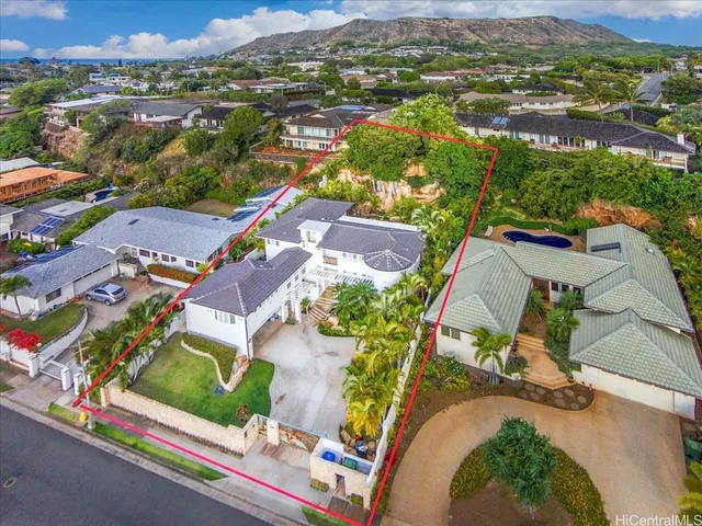 an aerial view of residential houses with outdoor space