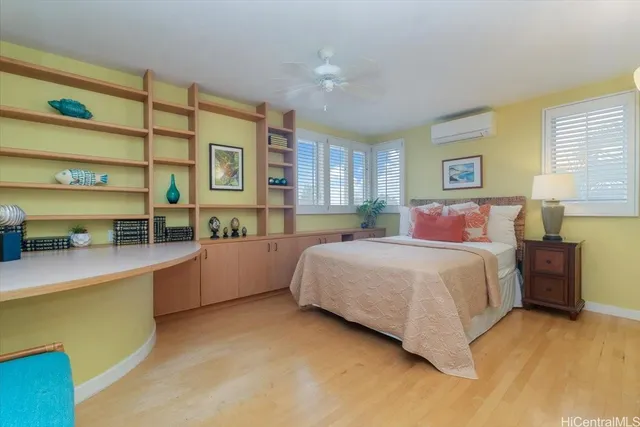 a bedroom with a bed and a cabinets