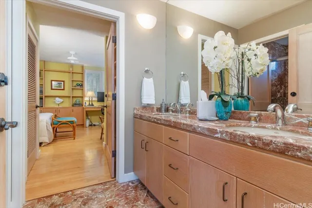 a spacious bathroom with a granite countertop sink mirror and a bath room
