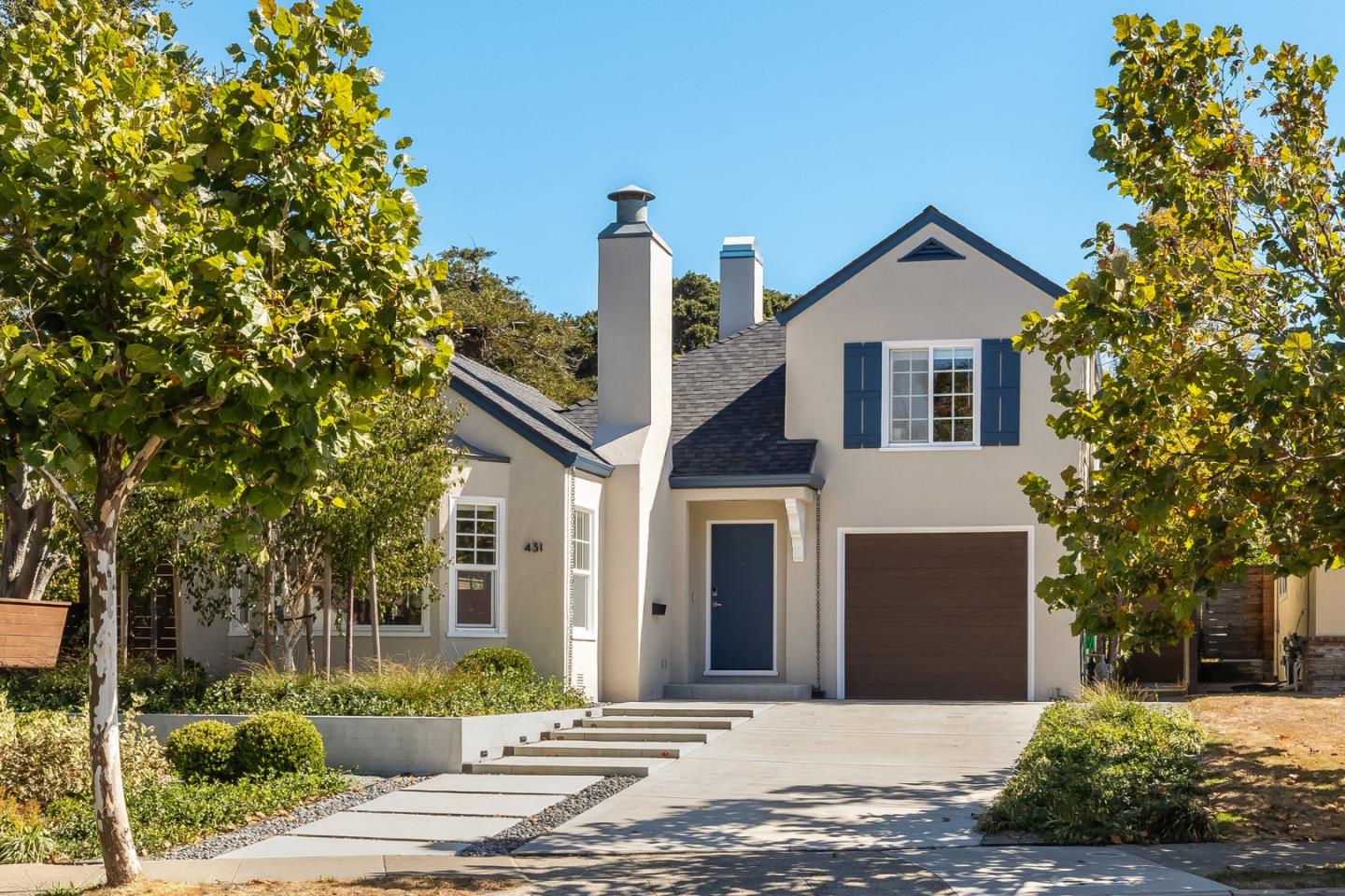 a front view of a house with a yard