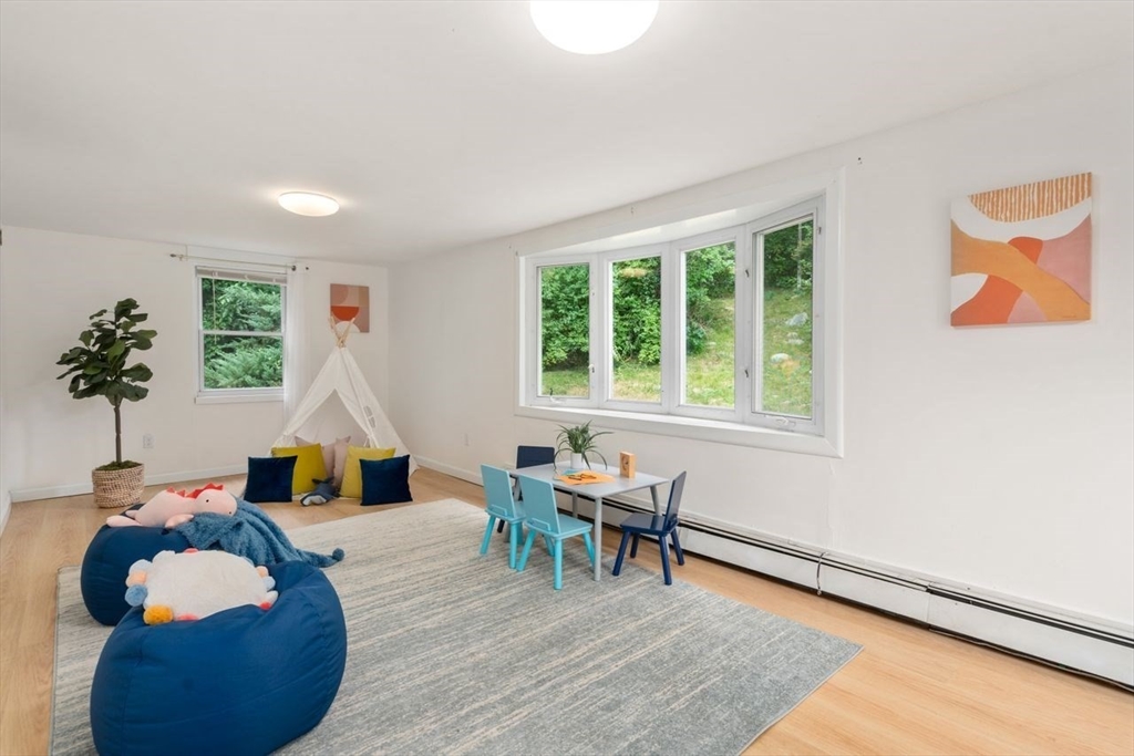 10 Temi Road Chelmsford, MA 01824 - Photo 13 of 22 a living room with furniture and a potted plant