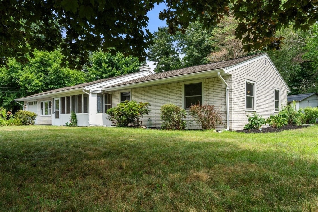 10 Temi Road Chelmsford, MA 01824 - Photo 20 of 22 a front view of house with yard and green space