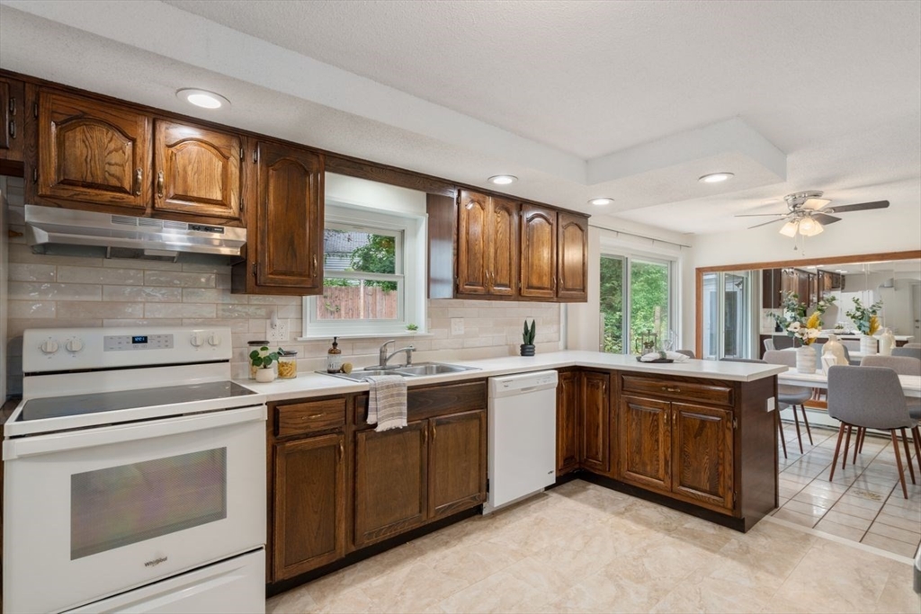 10 Temi Road Chelmsford, MA 01824 - Photo 7 of 22 a kitchen with a sink stove and microwave