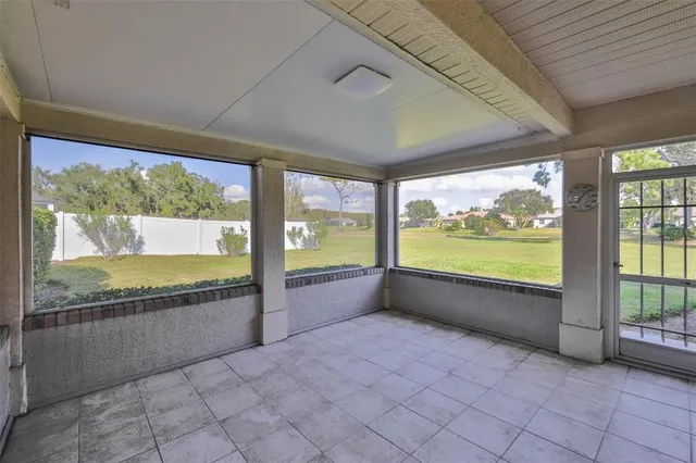 a view of an empty room with a large window
