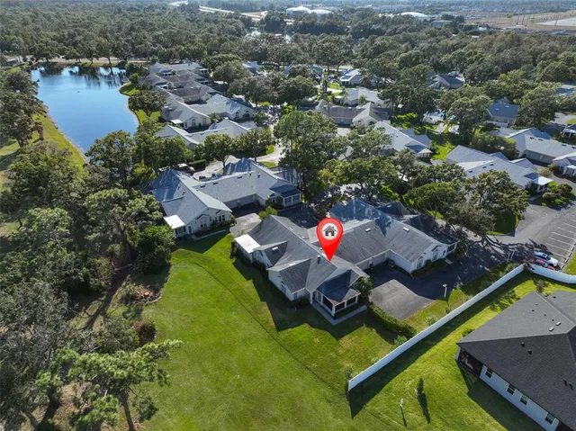 an aerial view of house with yard